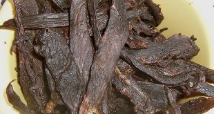 Several stripes of sage jerky in a yellow bowl